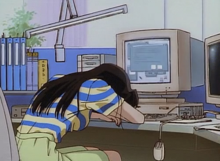Girl slouched over computer monitor.